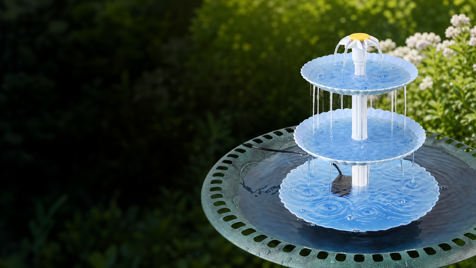 Three-tier solar fountain in a bird bath